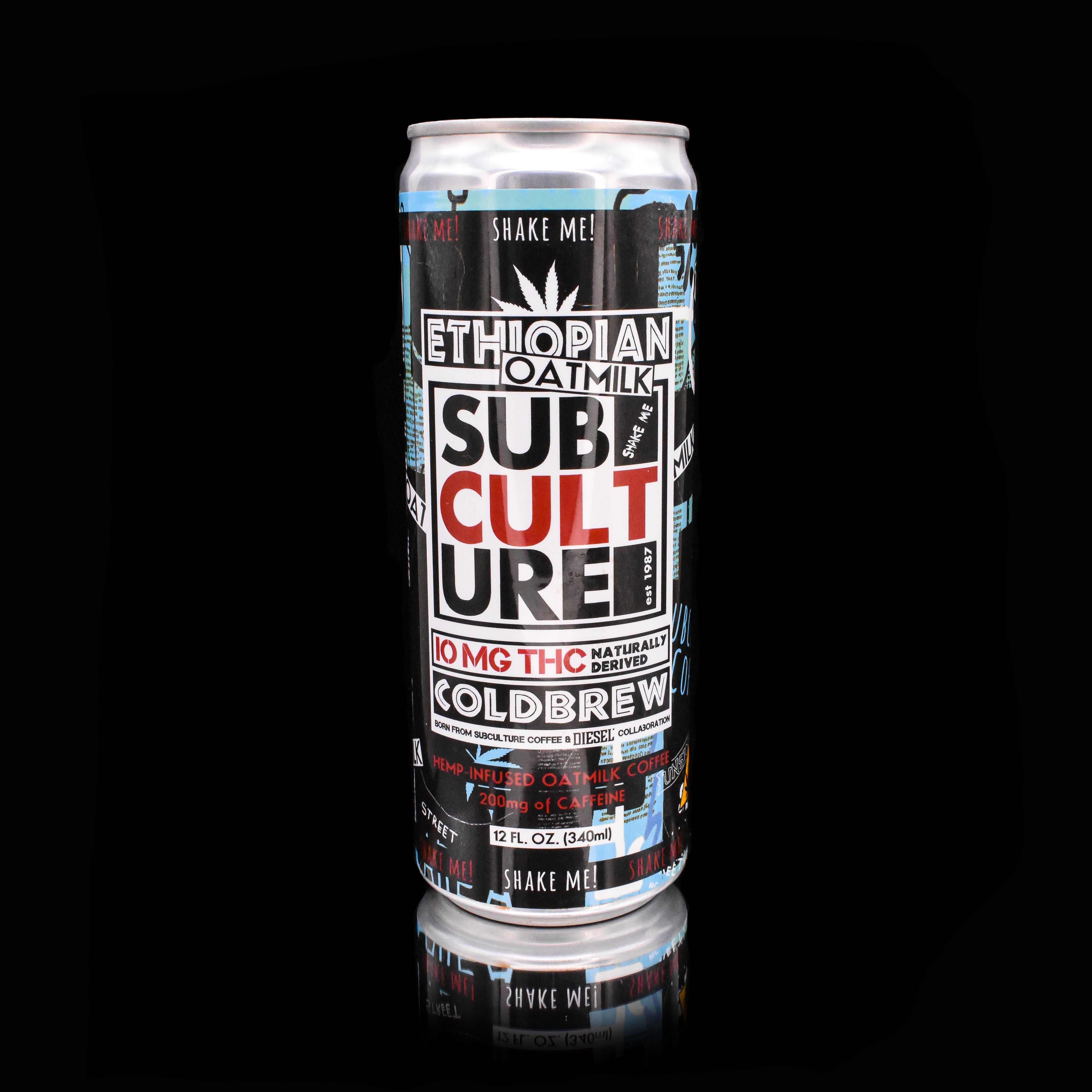 Hand holding a can of Ethiopian Sub Culture Cold Brew against a clear blue sky.